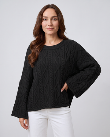 Women's black oversized cable knit round neck sweater with wide sleeves
