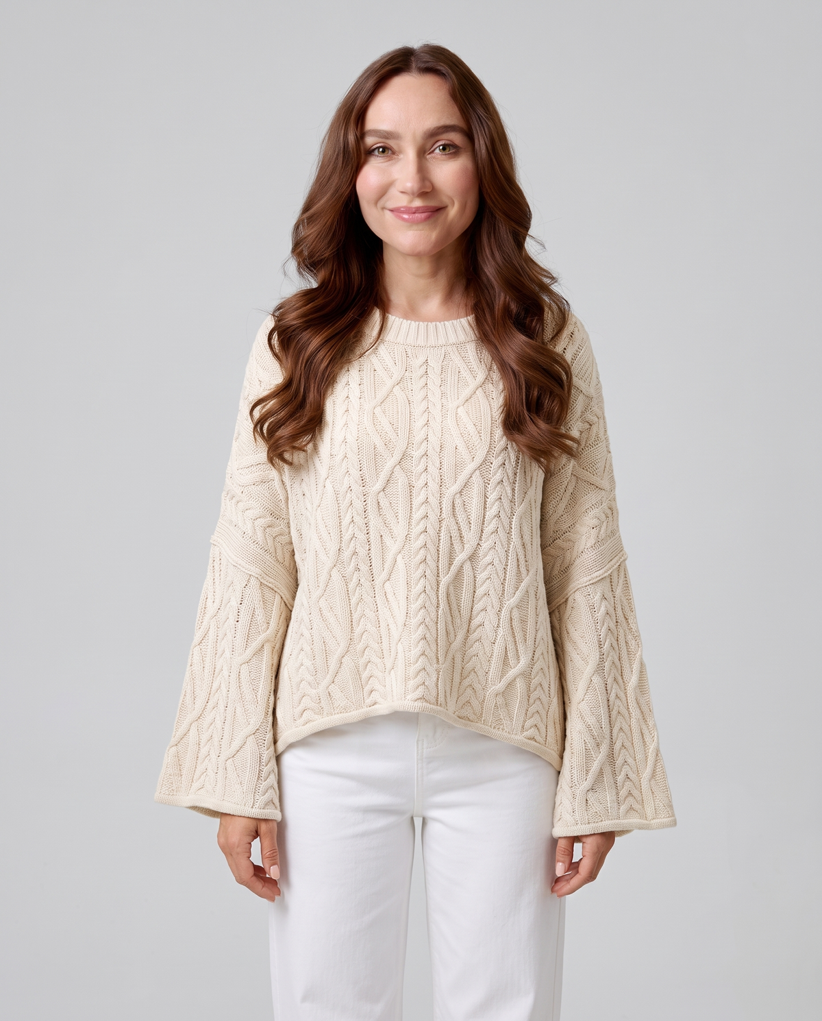 Women's apricot oversized cable knit round neck sweater with wide sleeves