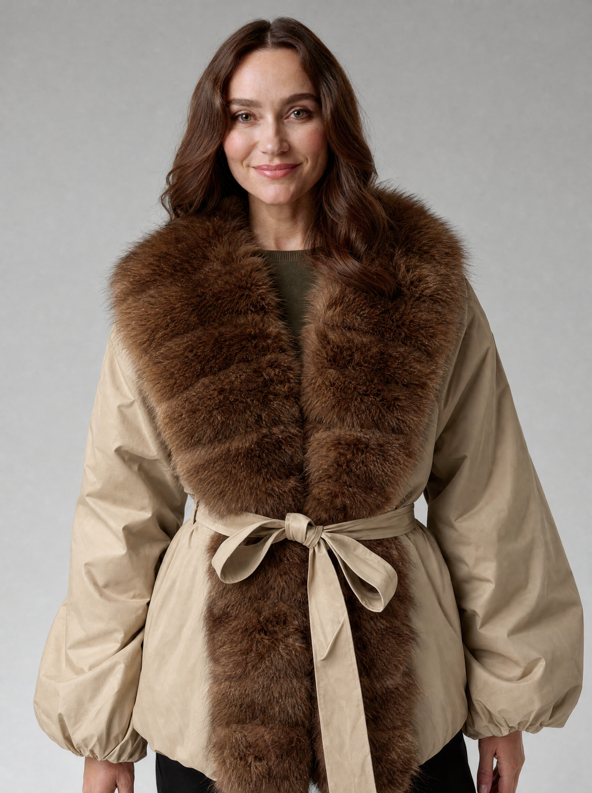 Wide brown fur collar and belt detail of khaki winter jacket