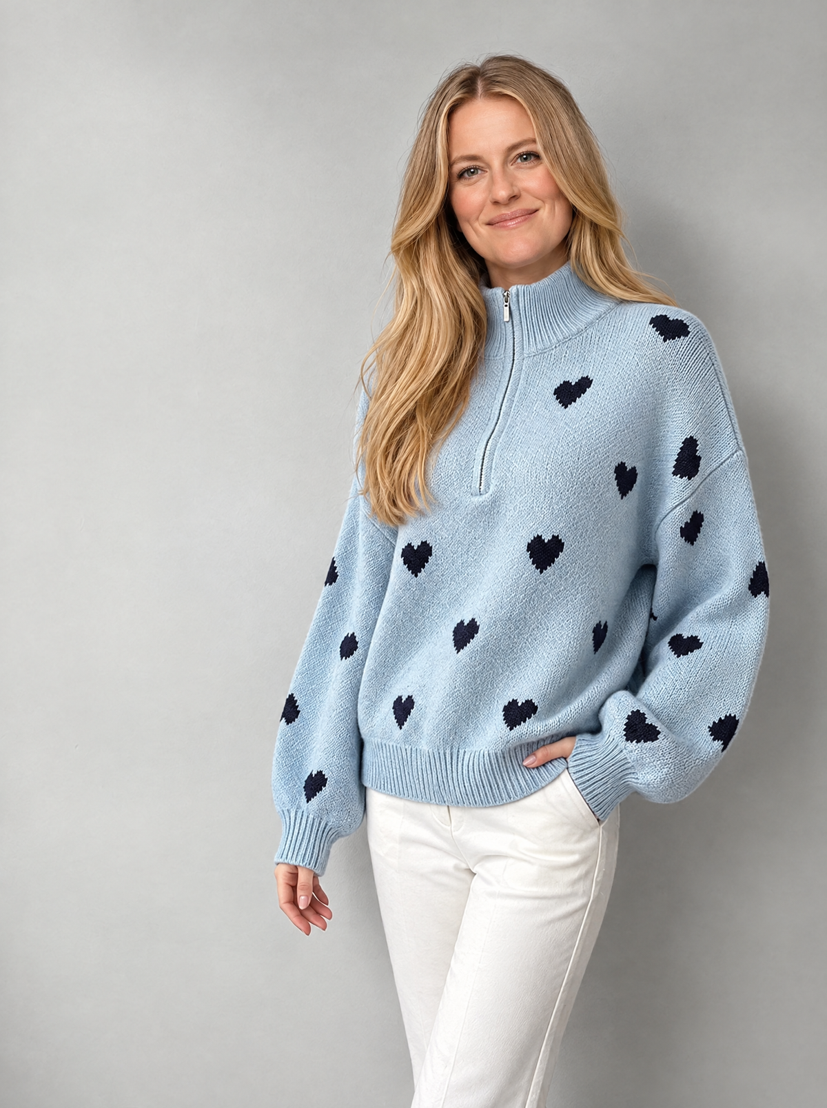 Blonde model wearing high-neck zipper jacquard knit sweater, side view