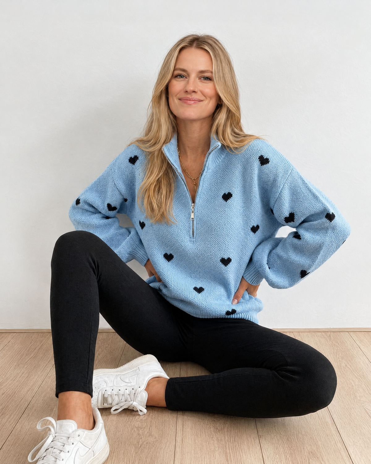 Blonde model in high-neck jacquard knit sweater detail