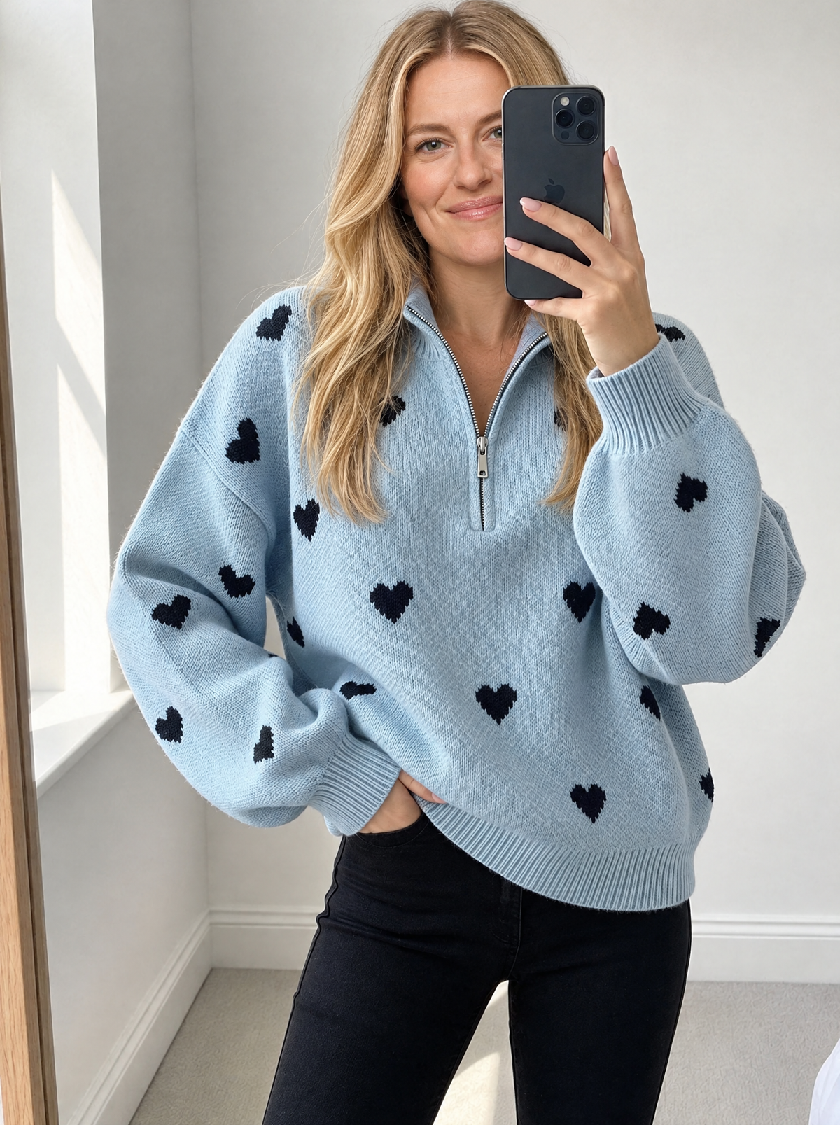 Blonde model wearing high-neck zipper jacquard knit sweater, front view