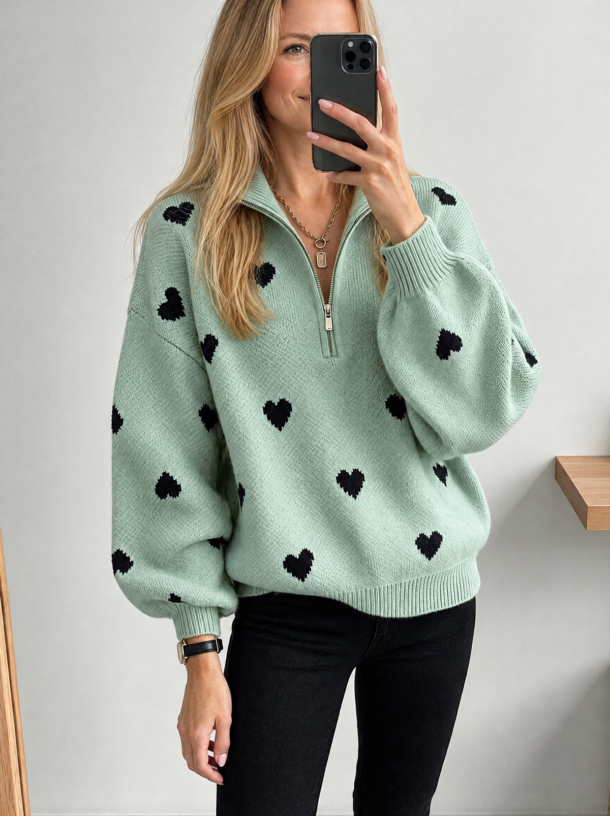 Blonde model wearing half-zip high-neck knit sweater