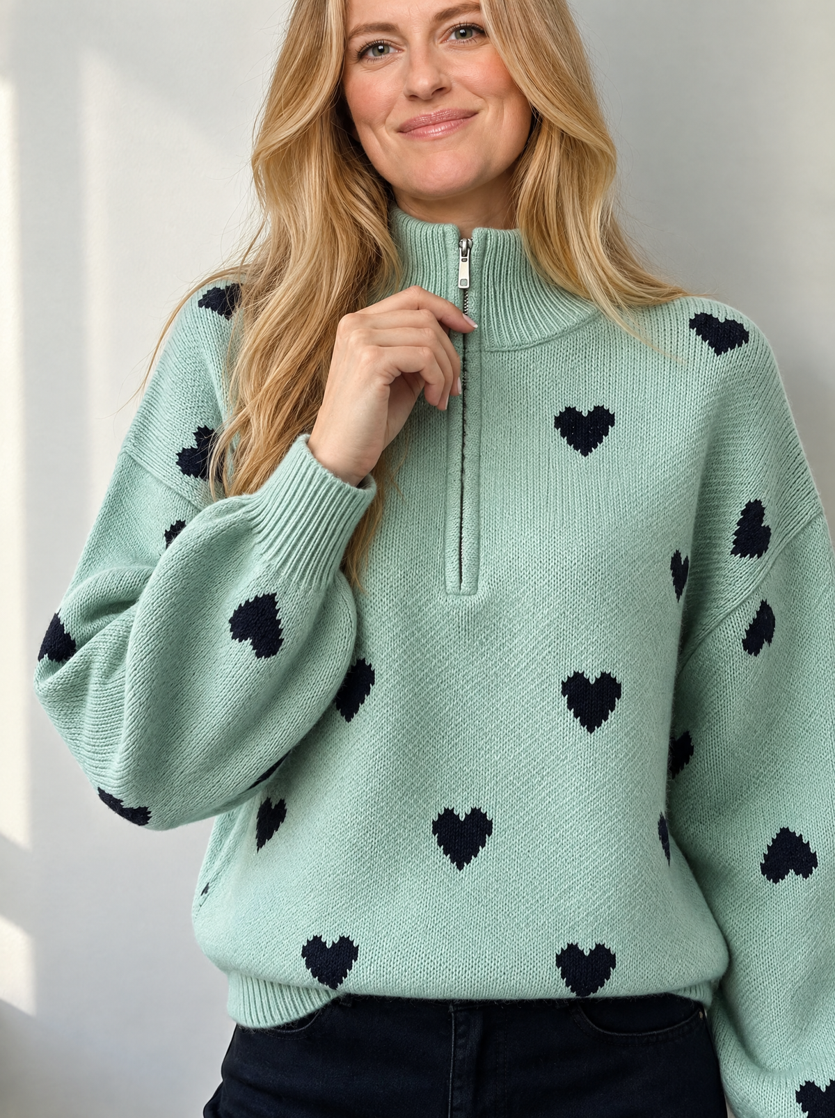 Blonde model styling the jacquard zipper knit sweater