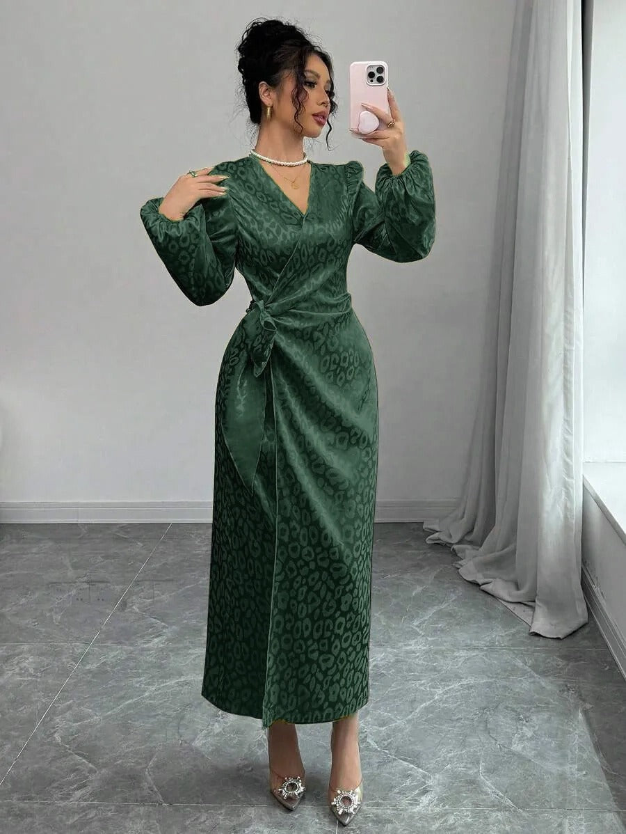 Leopard print satin maxi dress with long sleeves on a model